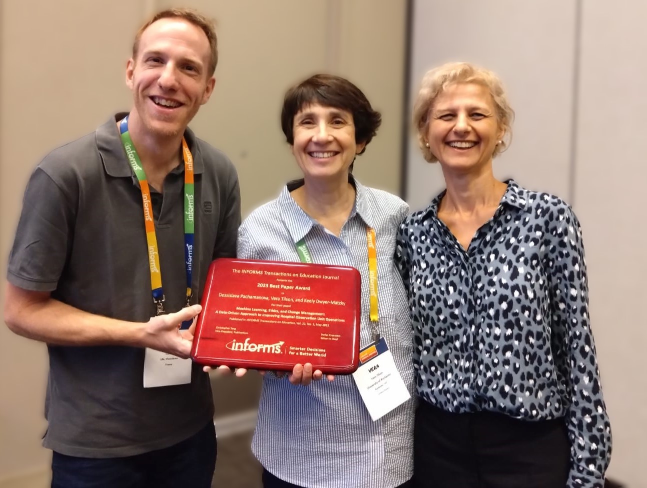 Stefan Creemers, EIC of ITE presents the journal's first Best Paper Award to Vera Tilson, Dessislava Pachamanova, and Keely Dwyer-Matzky (not pictured).